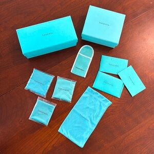 Tiffany boxes, cleaning cloths, eyeglasses dust case, card